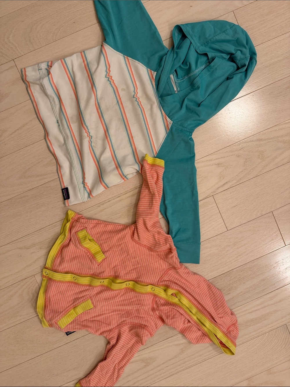 Patagonia hooded sun shirt and pink hoodie